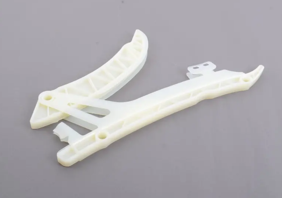 Chain tensioner and guide rail